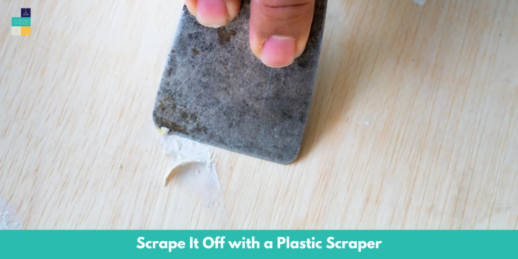 Scrape It Off with a Plastic Scraper for vinyl flooring cleaing